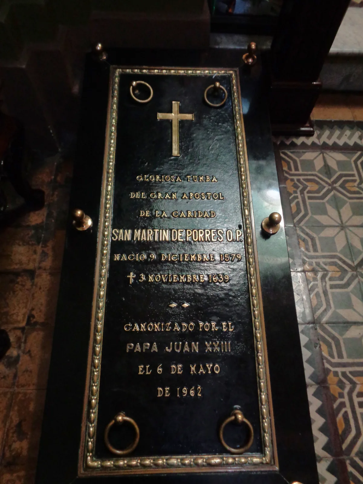 The marble tomb marker of Saint Martin de Porres in the Convent of Santo Domingo in Lima, inscribed with his name and dates.