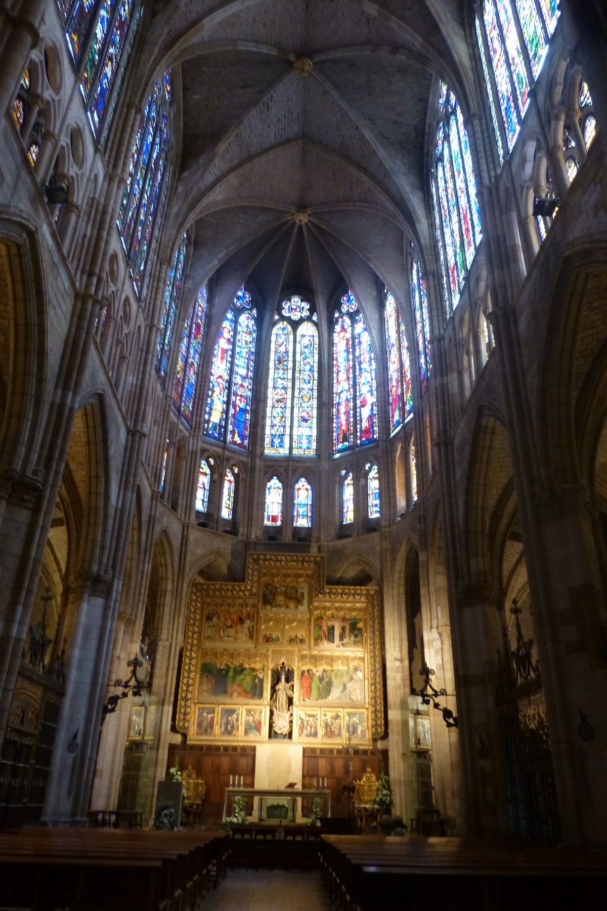 The nave and stained glass above the altar inside Leon Cathedral.