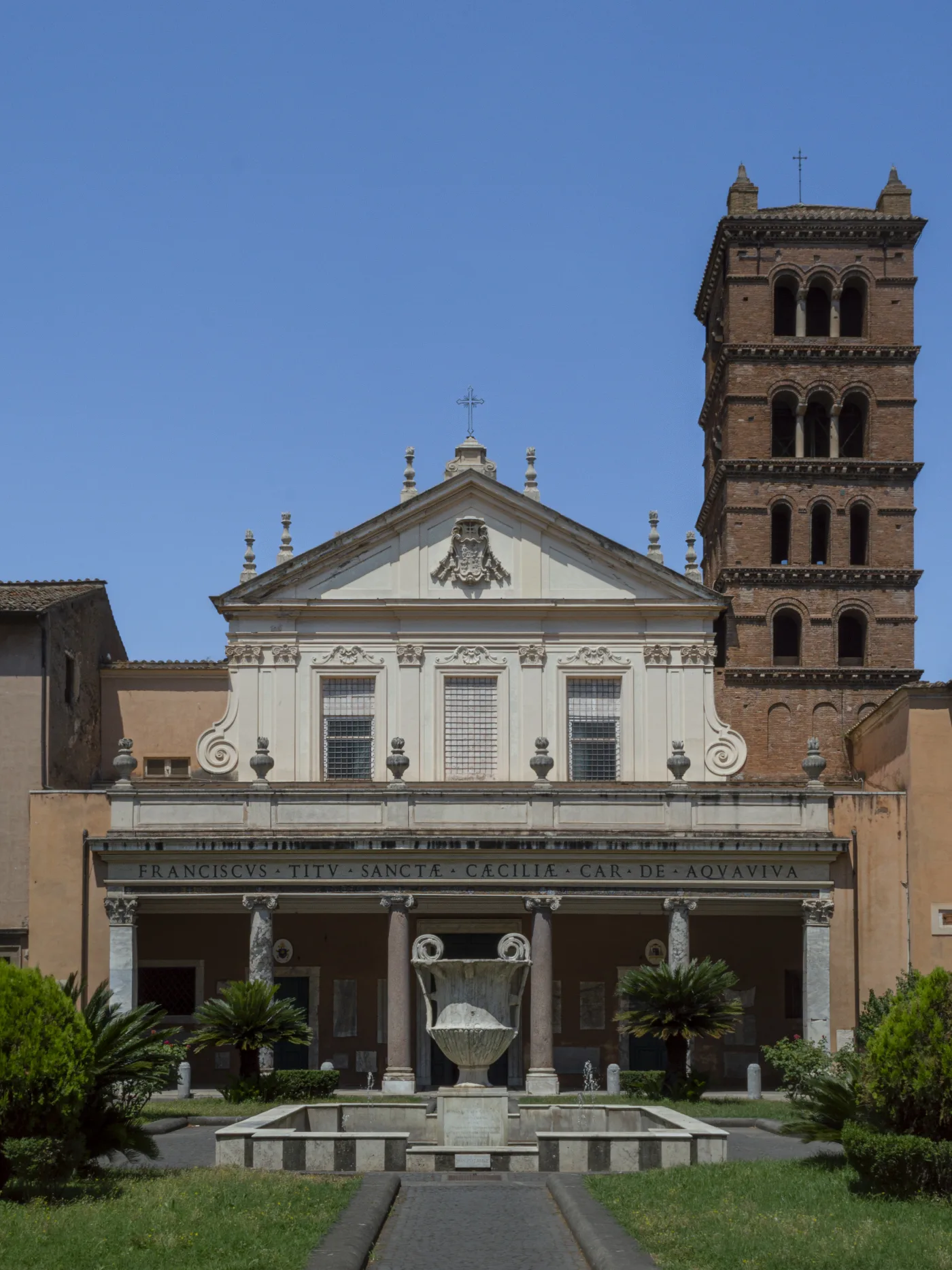 The Baroque facade and walled forecourt of the basilica of Santa Cecilia in Trastevere, Rome