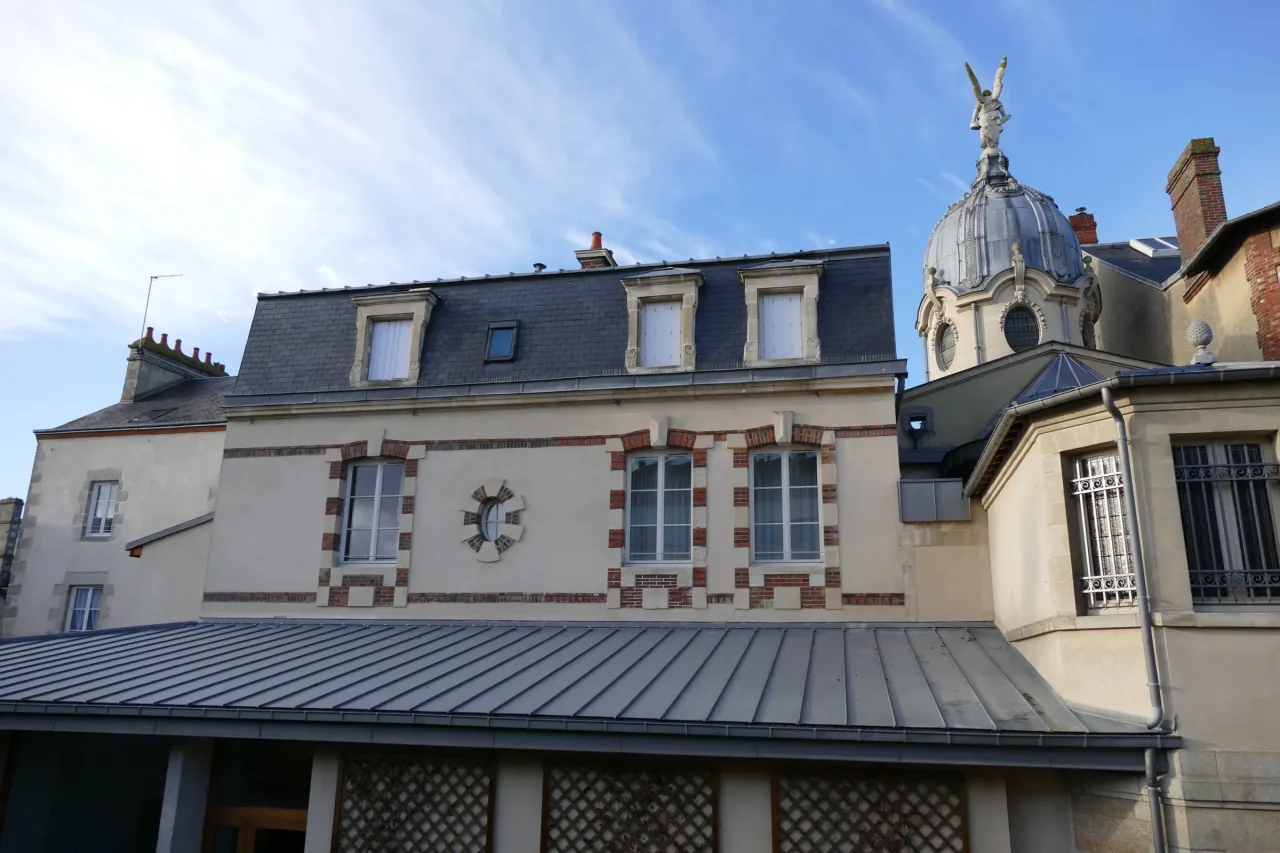 The roof of the Martin family house in Alençon beside the lead dome of the chapel built alongside it.