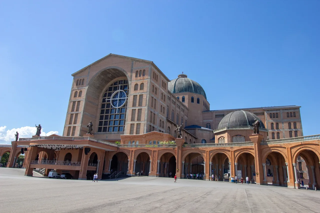 The brick National Shrine of Aparecida seen across its forecourt.