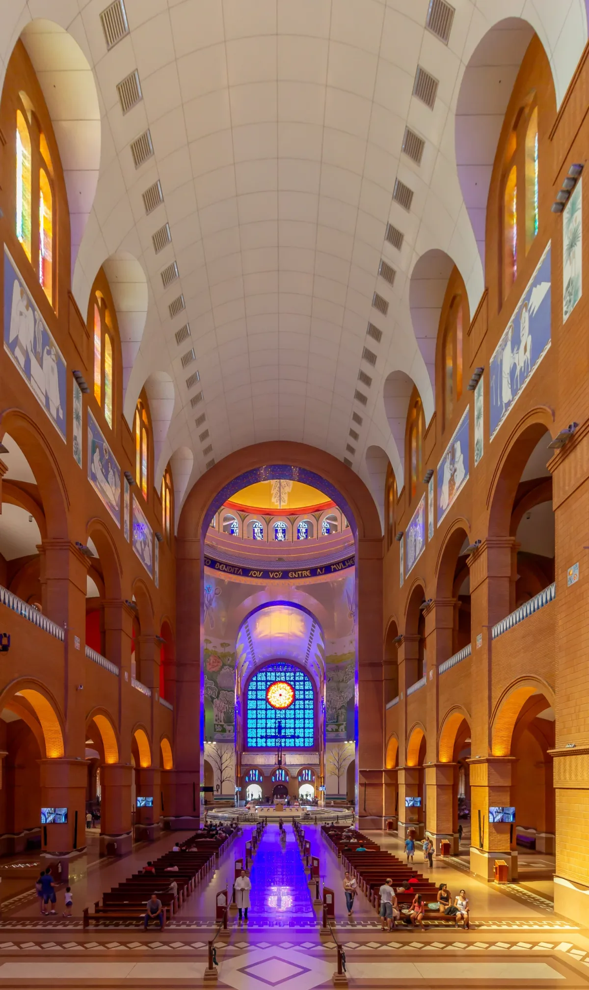 The tall nave and decorated sanctuary of the National Shrine of Aparecida.