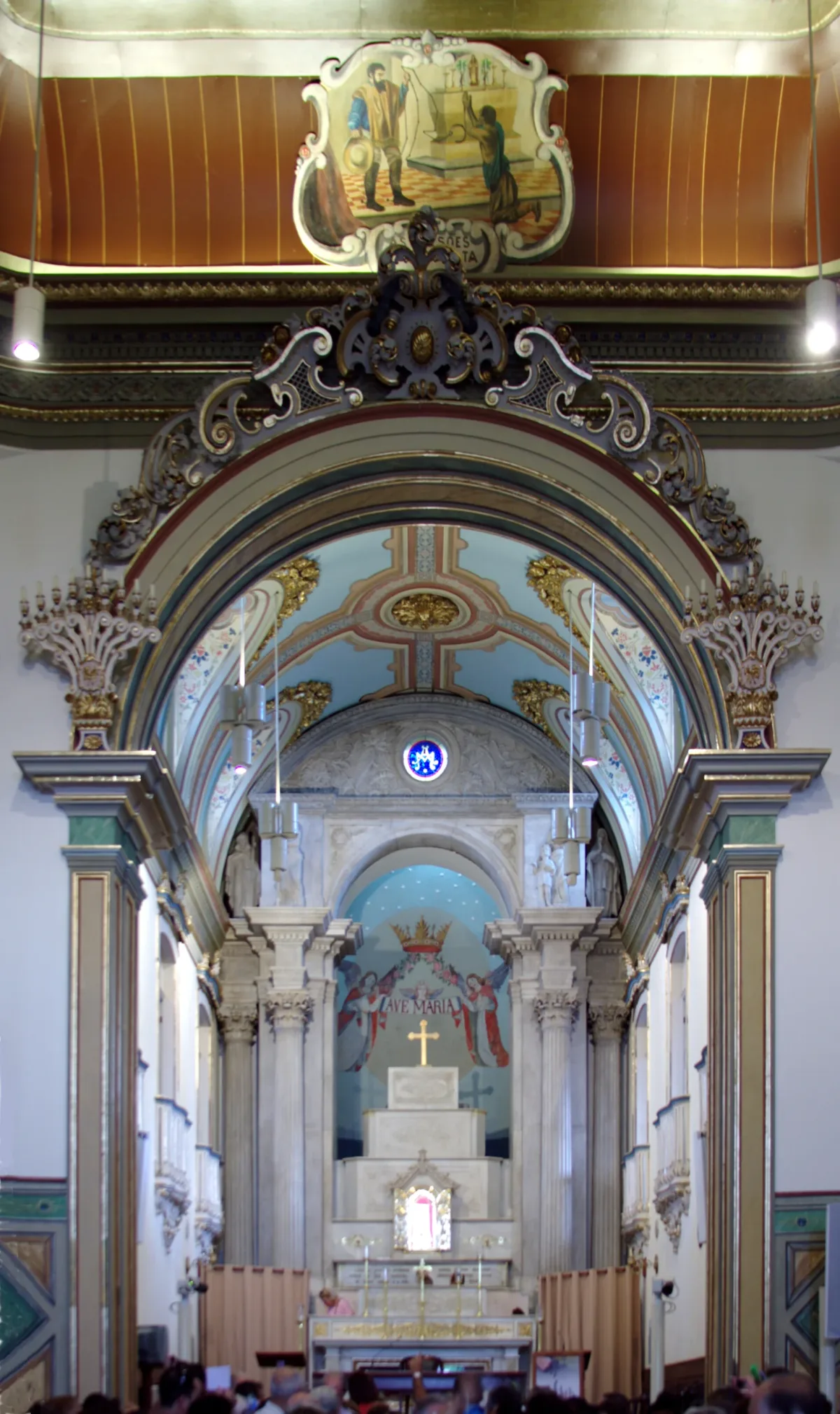 The decorated main altar and painted interior of the historic basilica.