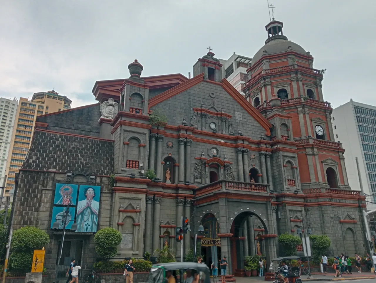 The stone facade and bell tower of Binondo Church at Plaza Lorenzo Ruiz.