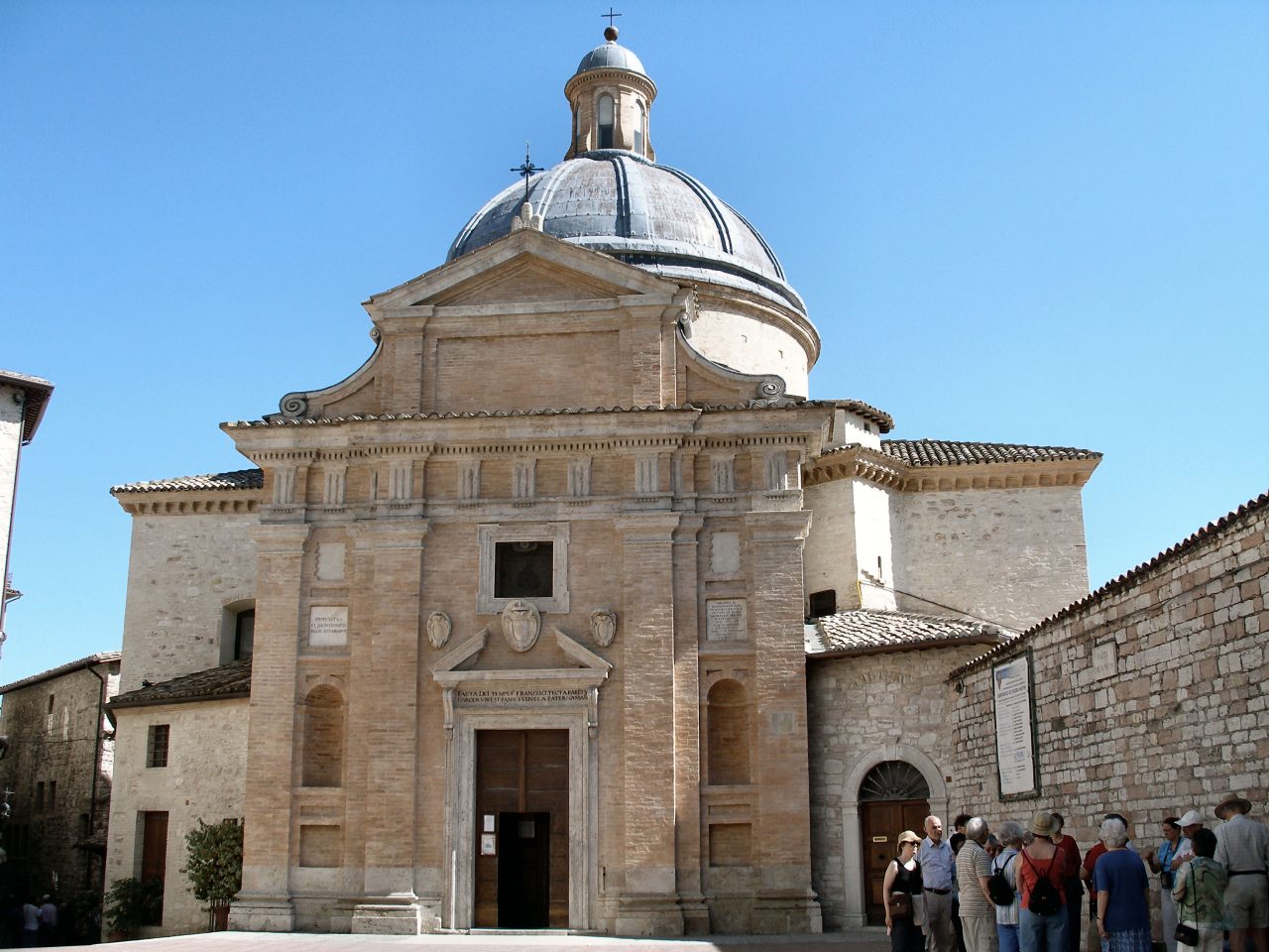 The facade and dome of Chiesa Nuova in the historic center of Assisi.