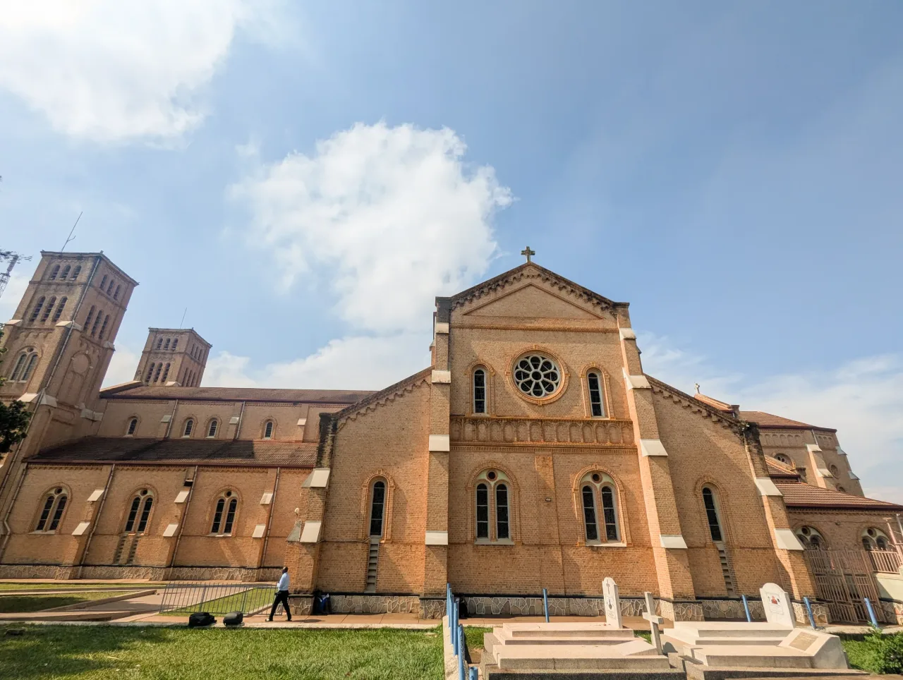 The brick side and rose window of St. Mary's Cathedral Lubaga.
