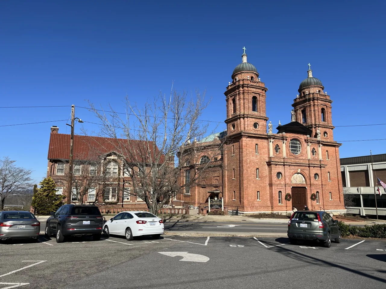 The brick and stone exterior of the Basilica of Saint Lawrence in Asheville.