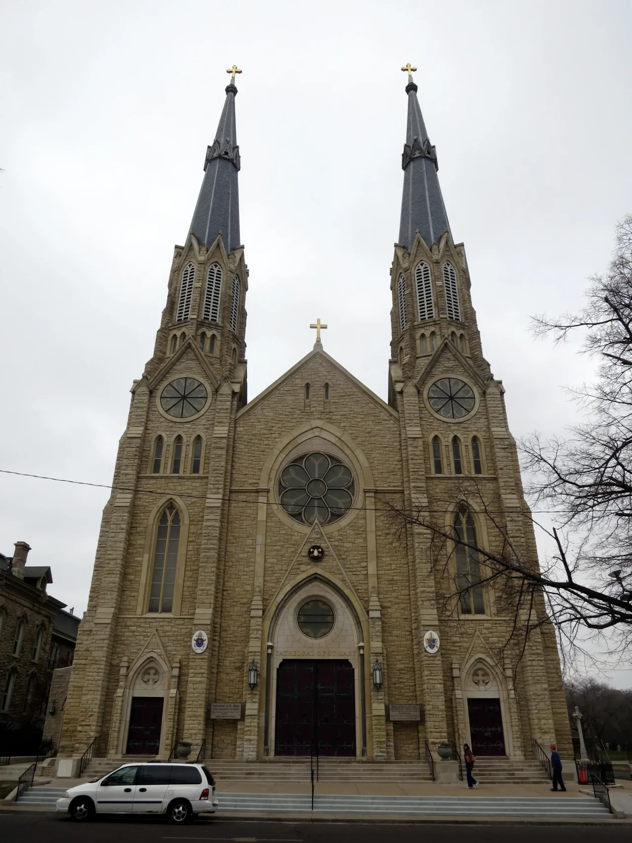 The twin-spired stone facade of Saint Mary's Cathedral in Peoria, Illinois.