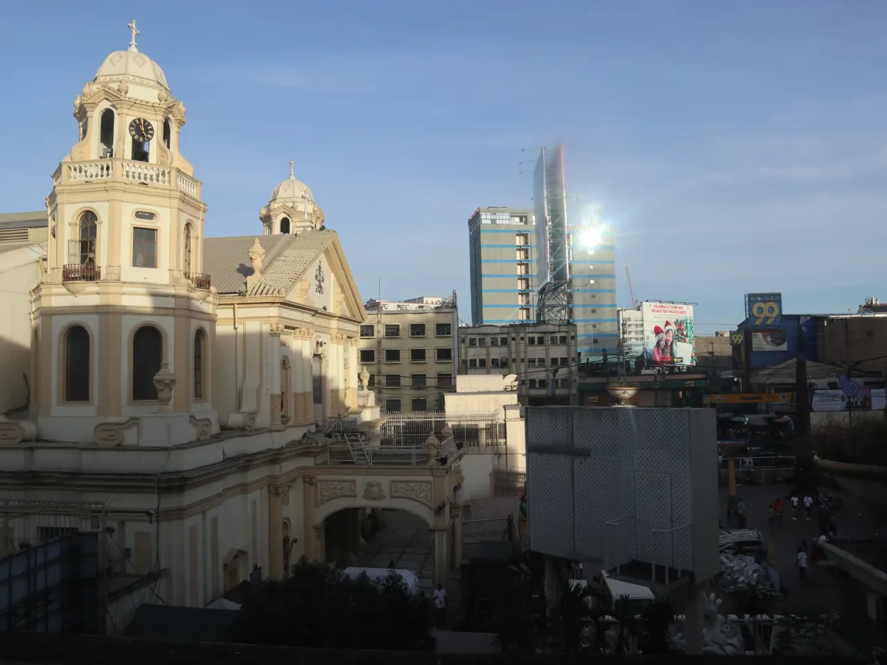 Quiapo Church beside Plaza Miranda and the surrounding city streets.
