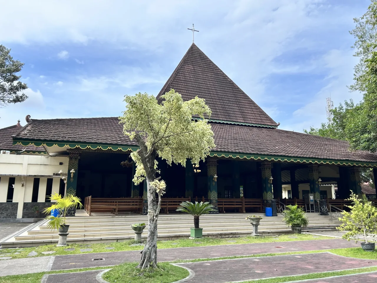 The facade of Sacred Heart Church at Ganjuran, with its twin towers and tiled roofs.