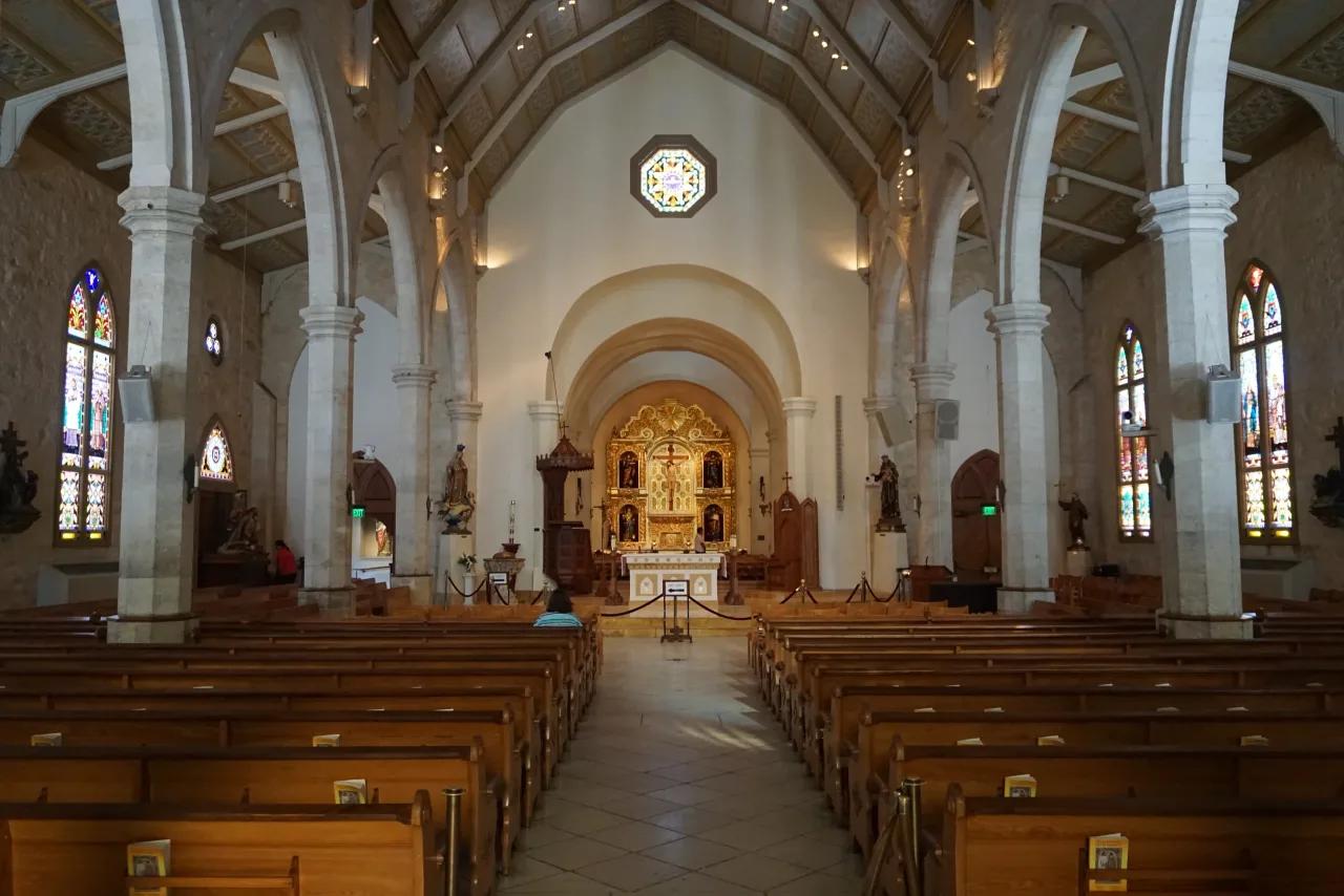 The nave of San Fernando Cathedral looking toward the crucifix and sanctuary.