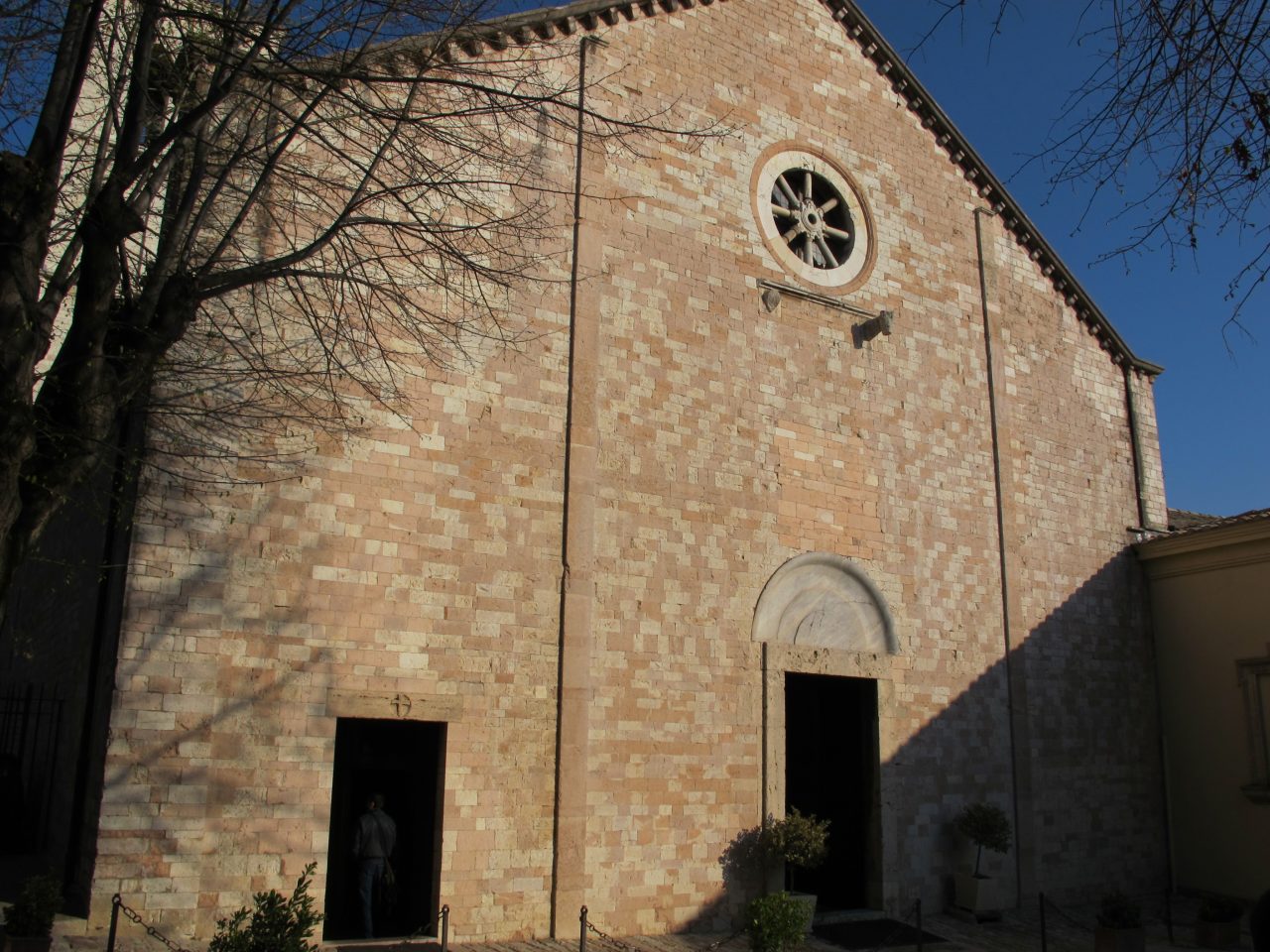 The stone facade of Santa Maria Maggiore in Assisi, the church of the Santuario della Spogliazione.
