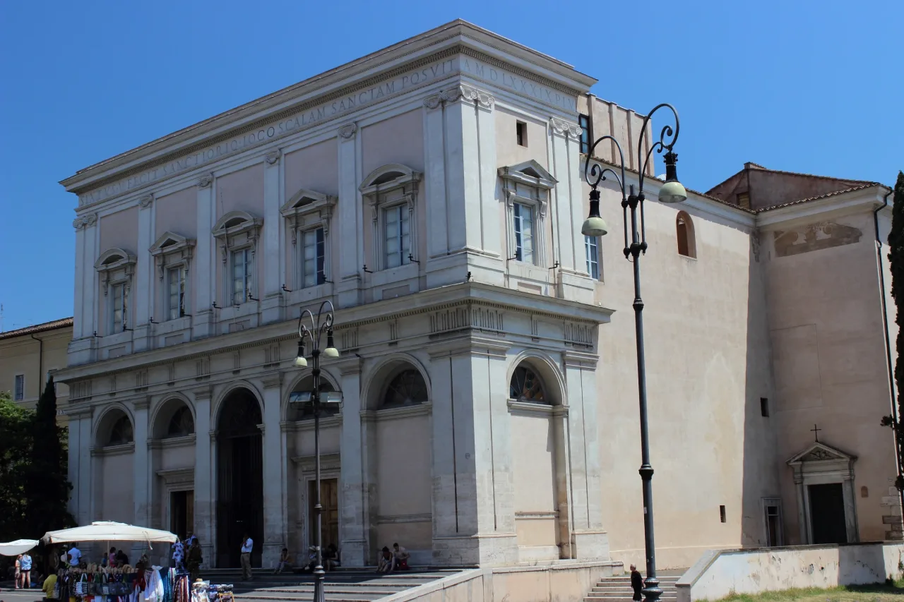 The pale facade and entrance of the Scala Sancta sanctuary beside Saint John Lateran in Rome.