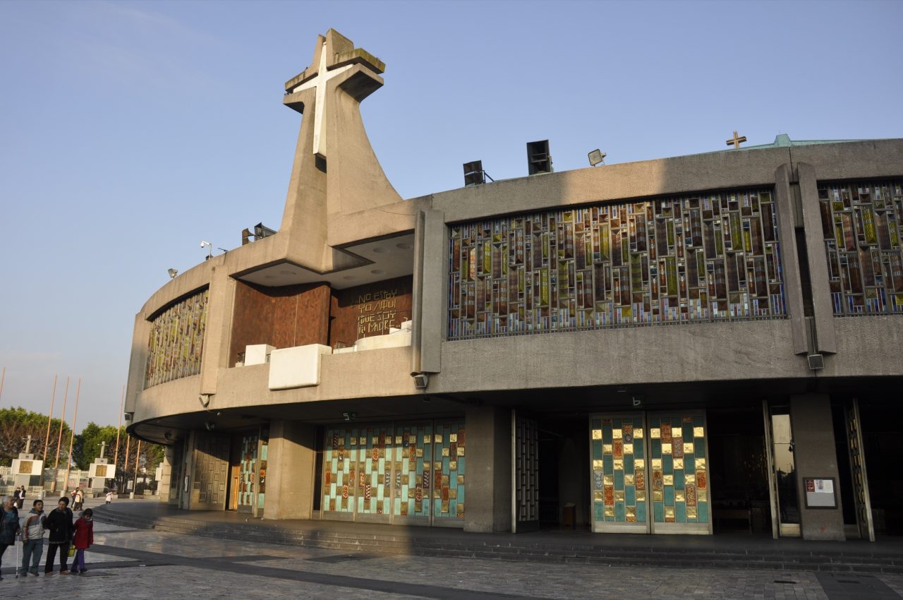 The modern circular New Basilica of Our Lady of Guadalupe in Mexico City, with its great cross over the entrance.