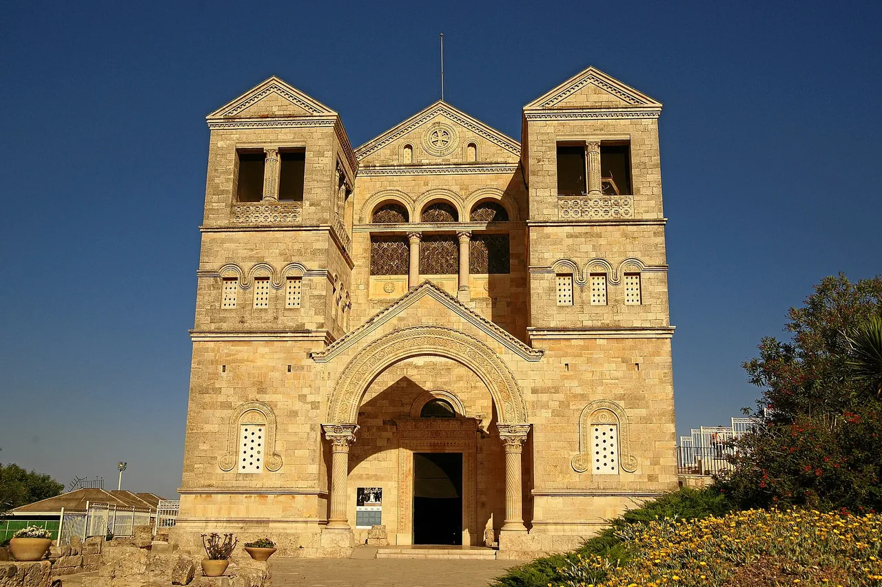 The twin-towered stone facade of the Basilica of the Transfiguration on Mount Tabor.