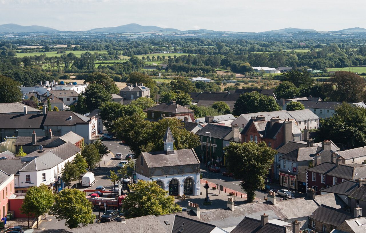 Kildare's market square and the surrounding town seen from the top of the round tower, with the Kildare countryside beyond.