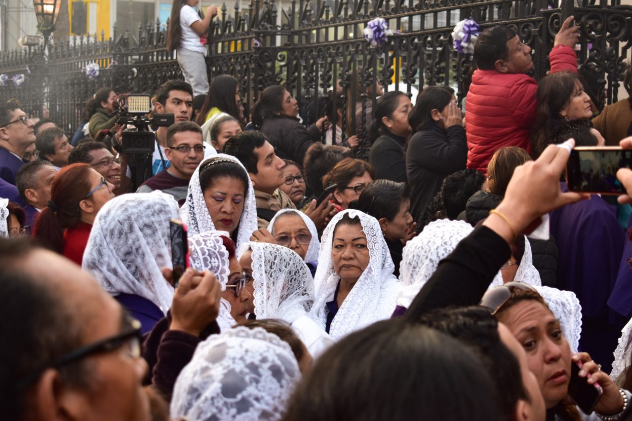 Women of the incense guild walking in the October procession of the Lord of Miracles in Lima.