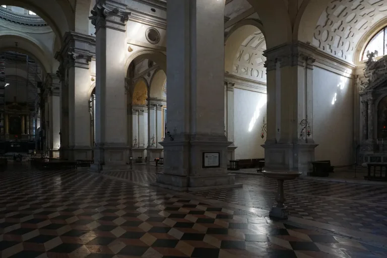 The long bright nave and side chapels inside the Basilica of Santa Giustina in Padua.