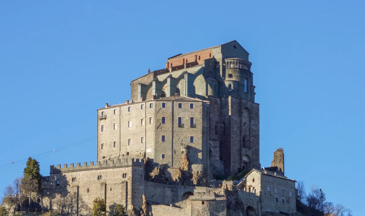The Sacra di San Michele rises directly from the rocky summit of Mount Pirchiriano above the Susa Valley.