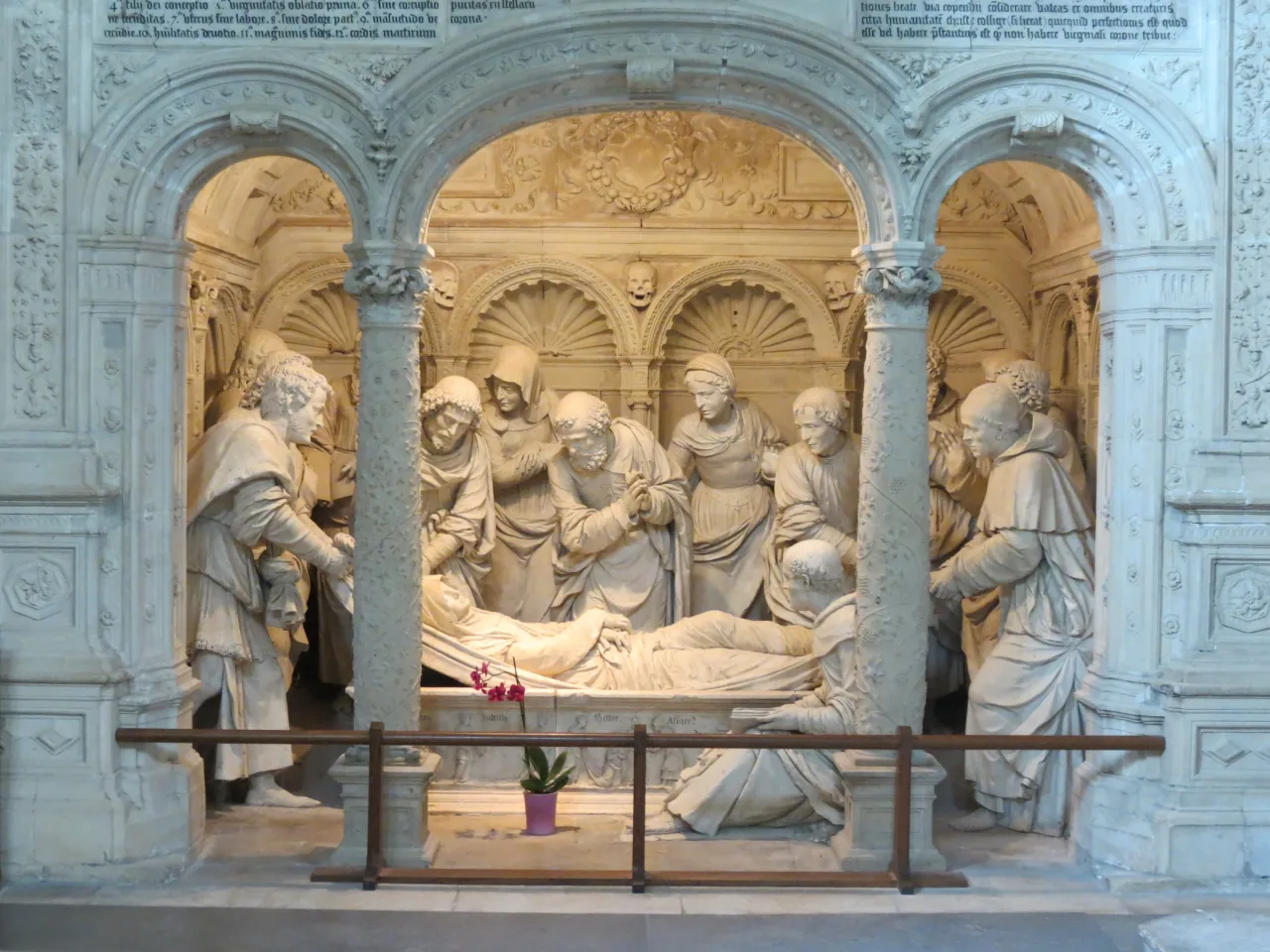 The carved burial of the Virgin Mary in the Belle Chapelle at Solesmes, with figures gathered around her reclining body.