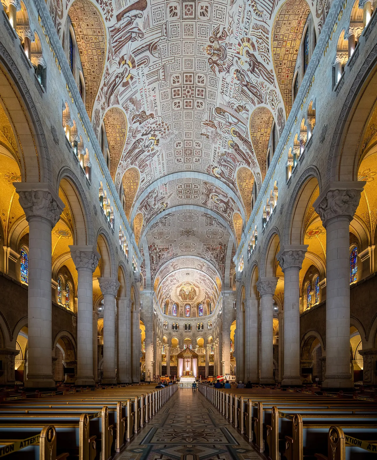 The long nave and decorated ceiling of the Basilica of Sainte-Anne-de-Beaupré.