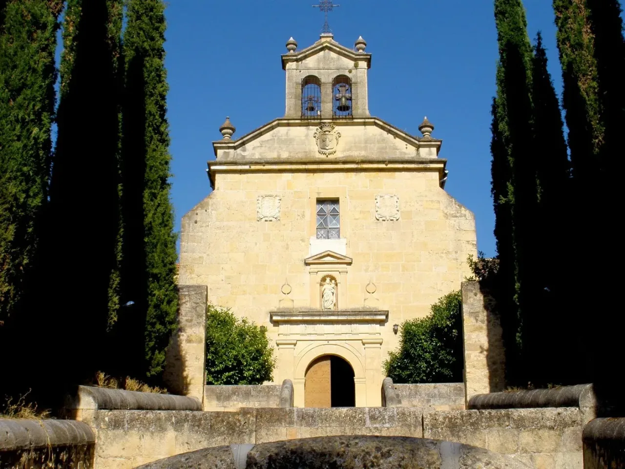 The church of the Convento de los Carmelitas Descalzos at Segovia among its cypresses.