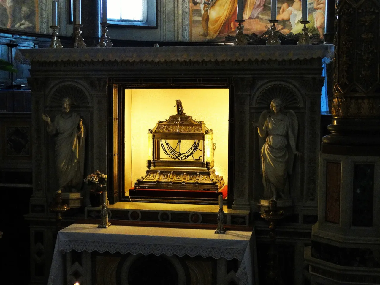 The reliquary of the Chains of Saint Peter: two dark iron chains behind glass in a gilt bronze case at San Pietro in Vincoli.