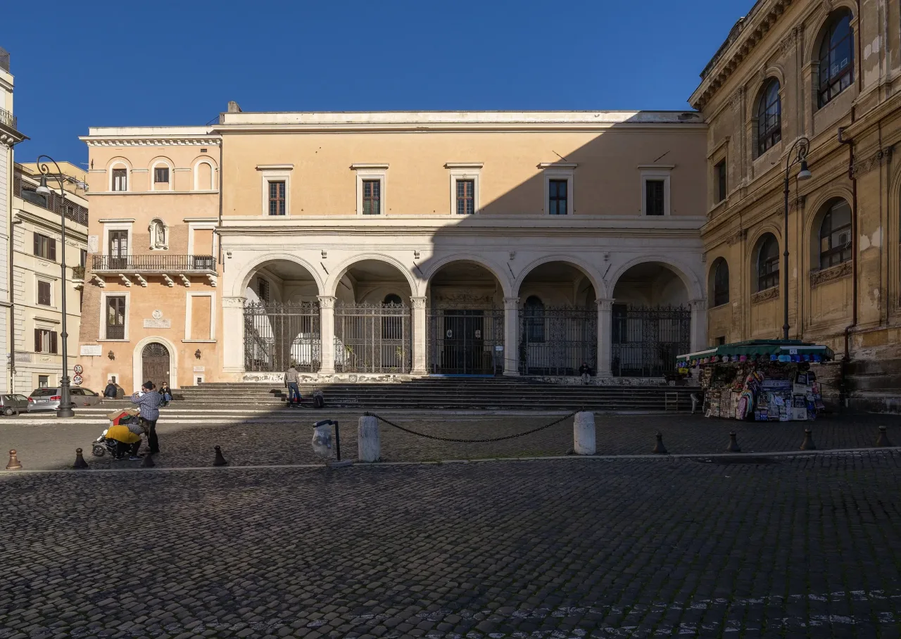 The arcaded Renaissance portico of San Pietro in Vincoli across its quiet cobbled piazza on the Esquiline.