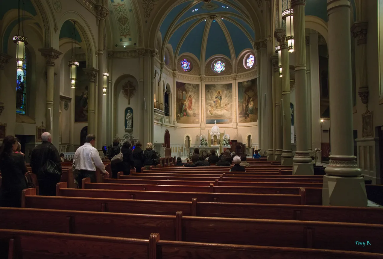The nave and richly appointed sanctuary of the Basilica Shrine of Our Lady of the Miraculous Medal in Philadelphia.