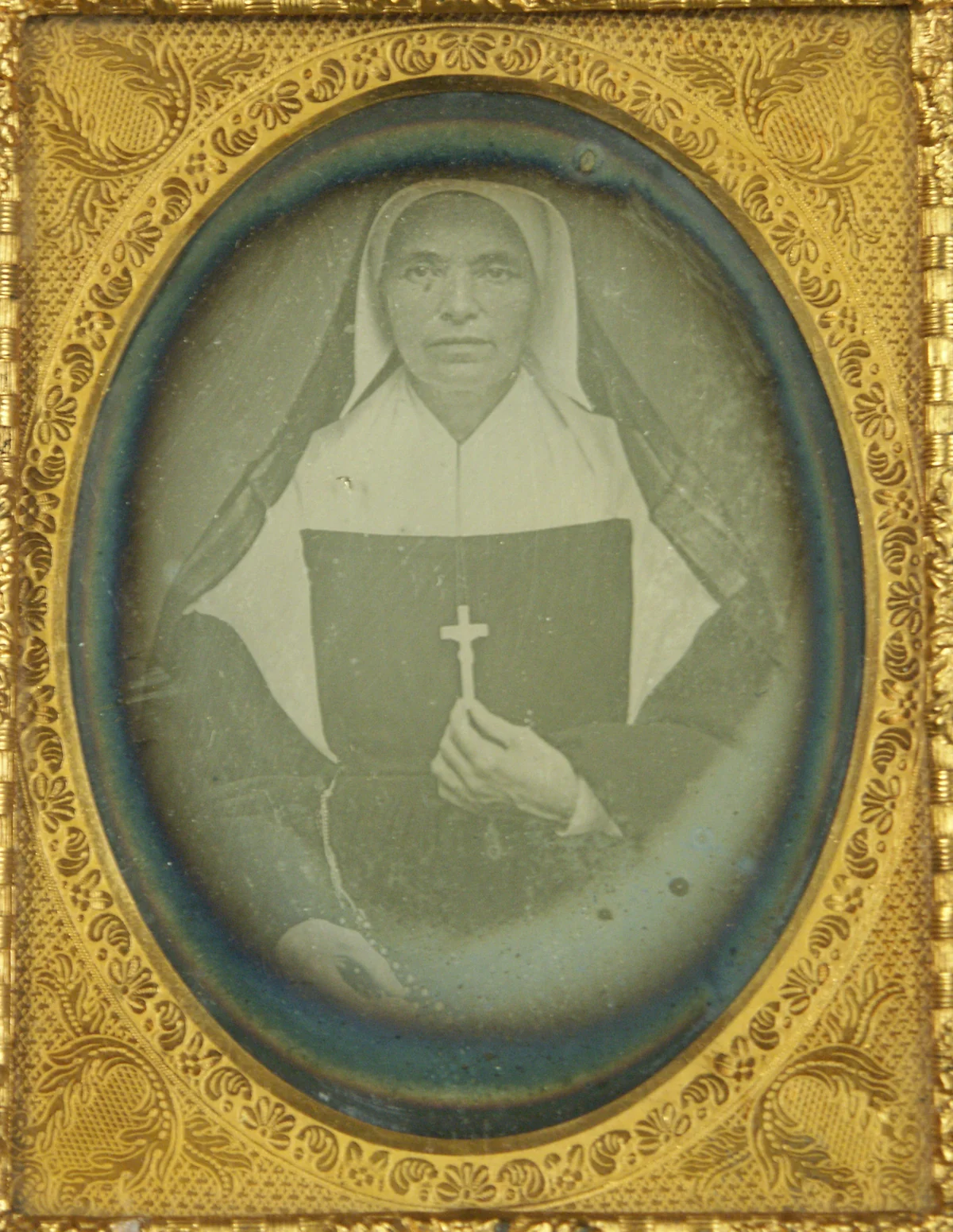 Nineteenth-century daguerreotype of Saint Mother Theodore Guérin holding a small cross.